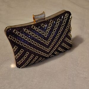 Elegant Purple and Gold Clutch